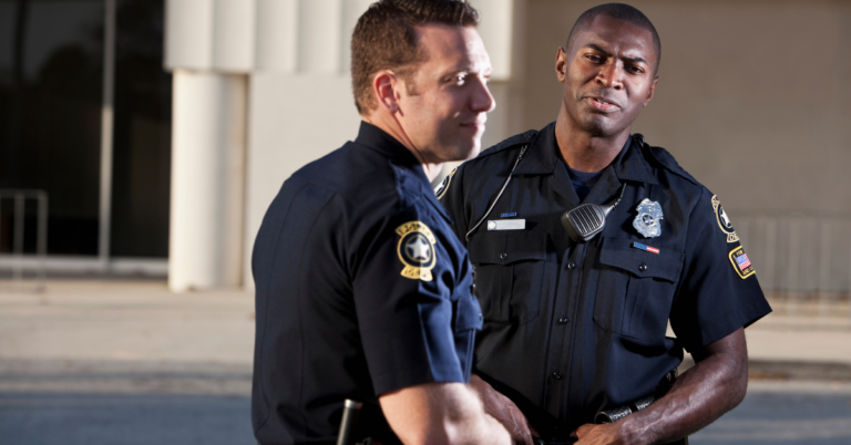 Police officers wearing duty belts to show duty belt back pain